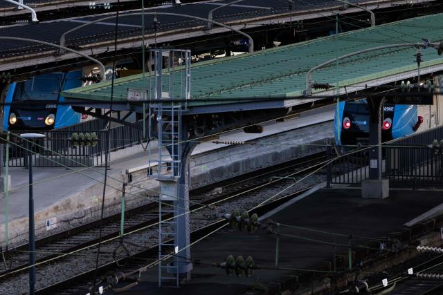 (FILES) This photograph shows a train on the tracks at Gare de l'Est railway station in Paris on March 14, 2026. One in ten trains is being cancelled on June 22, 2026, in the Ile-de-France region as a preventive measure, in order to protect the railway network infrastructure, which will be under heavy strain from the heatwave in the coming days, said Valerie Pécresse, president of Ile-de-France Mobilites (IDFM), and SNCF Reseau. (Photo by JOEL SAGET / AFP)
