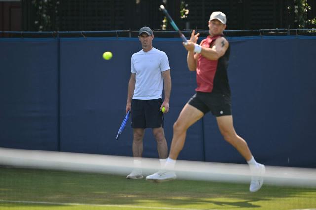 Britain's Andy Murray, now coaching, watches Britain's Jack Draper practice ahead of his men's singles round of 32 tennis match on day one of the Lexus Eastbourne Open at Devonshire Park, Eastbourne, on the south coast of England on June 22, 2026. (Photo by Glyn KIRK / AFP)