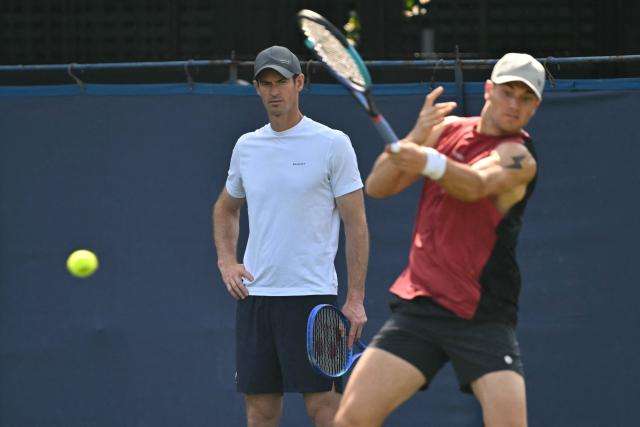 Britain's Andy Murray, now coaching, watches Britain's Jack Draper practice ahead of his men's singles round of 32 tennis match on day one of the Lexus Eastbourne Open at Devonshire Park, Eastbourne, on the south coast of England on June 22, 2026. (Photo by Glyn KIRK / AFP)