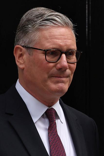 Britain's Prime Minister Keir Starmer poses at the door to 10 Downing Street after making a statement on his future outside 10 Downing Street on the morning of June 22, 2026, in London. British Prime Minister Keir Starmer announced his resignation on Monday after fewer than two years in office in a term characterised by policy U-turns and deep public unpopularity. (Photo by Adrian Dennis / AFP)