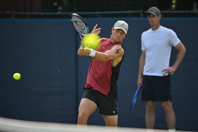 Britain's Andy Murray (R), now coaching, watches Britain's Jack Draper practice ahead of his men's singles round of 32 tennis match on day one of the Lexus Eastbourne Open at Devonshire Park, Eastbourne, on the south coast of England on June 22, 2026. (Photo by Glyn KIRK / AFP)