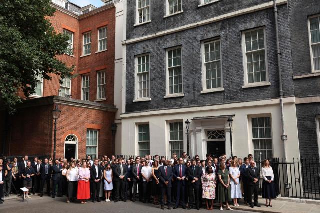 Britain's Justice Secretary and deputy Prime Minister David Lammy (C) stands with members of Downing Street staff as Britain's Prime Minister Keir Starmer makes a statement on his future outside 10 Downing Street on the morning of June 22, 2026, in London. British Prime Minister Keir Starmer announced his resignation on Monday after fewer than two years in office in a term characterised by policy U-turns and deep public unpopularity. (Photo by Adrian DENNIS / AFP)