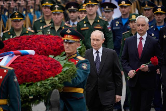 Russian President Vladimir Putin and Defence Minister Andrei Belousov attend a wreath-laying ceremony marking the 85th anniversary of the Nazi Germany invasion into the Soviet Union in World War II on the Remembrance and Sorrow Day at the Tomb of the Unknown Soldier by the Kremlin wall in Moscow on June 22, 2026. (Photo by Pavel Bednyakov / POOL / AFP)