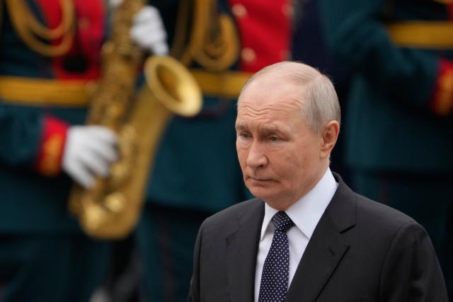 Russian President Vladimir Putin attends a wreath-laying ceremony marking the 85th anniversary of the Nazi Germany invasion into the Soviet Union in World War II on the Remembrance and Sorrow Day at the Tomb of the Unknown Soldier by the Kremlin wall in Moscow on June 22, 2026. (Photo by Pavel Bednyakov / POOL / AFP)
