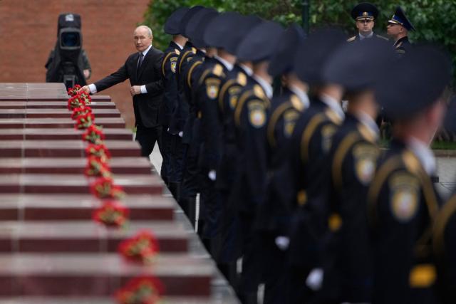 Russian President Vladimir Putin attends a wreath-laying ceremony marking the 85th anniversary of the Nazi Germany invasion into the Soviet Union in World War II on the Remembrance and Sorrow Day at the Tomb of the Unknown Soldier by the Kremlin wall in Moscow on June 22, 2026. (Photo by Pavel Bednyakov / POOL / AFP)