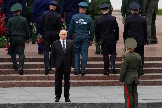 Russian President Vladimir Putin attends a wreath-laying ceremony marking the 85th anniversary of the Nazi Germany invasion into the Soviet Union in World War II on the Remembrance and Sorrow Day at the Tomb of the Unknown Soldier by the Kremlin wall in Moscow on June 22, 2026. (Photo by Alexander Zemlianichenko / POOL / AFP)