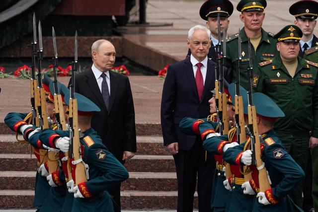 Russian President Vladimir Putin and Defence Minister Andrei Belousov attend a wreath-laying ceremony marking the 85th anniversary of the Nazi Germany invasion into the Soviet Union in World War II on the Remembrance and Sorrow Day at the Tomb of the Unknown Soldier by the Kremlin wall in Moscow on June 22, 2026. (Photo by Alexander Zemlianichenko / POOL / AFP)