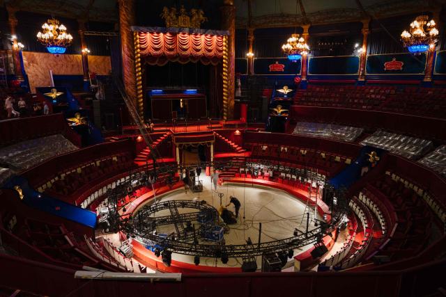 This photograph shows a general view of Paris' Cirque d’Hiver with an employee standing during its renovation, in Paris, on June 22, 2026. (Photo by Dimitar DILKOFF / AFP)