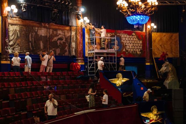Employees work on the renovation of Paris's Cirque d’Hiver in Paris, on June 22, 2026. (Photo by Dimitar DILKOFF / AFP)