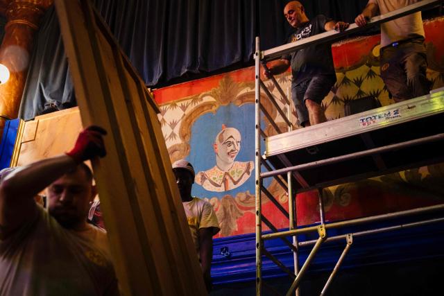 Employees work on the renovation of Paris's Cirque d’Hiver in Paris, on June 22, 2026. (Photo by Dimitar DILKOFF / AFP)