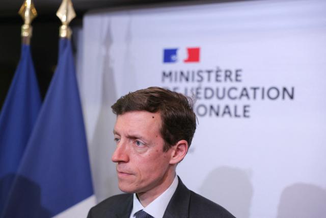 France's Education Minister Edouard Geffray looks on during a press briefing focused on the heatwave in France, at the Ministry of Education, in Paris on June 22, 2026. The heatwave that has been going in France for nearly a week, is causing major disruption to school life, with 845 primary and secondary schools closed on June 22, 2026 and a further 1,800 having adjusted their timetables out of the country’s 60,000 schools, according to the Ministry of Education – not to mention all the schools advising parents to keep their children at home. (Photo by Thomas SAMSON / AFP)
