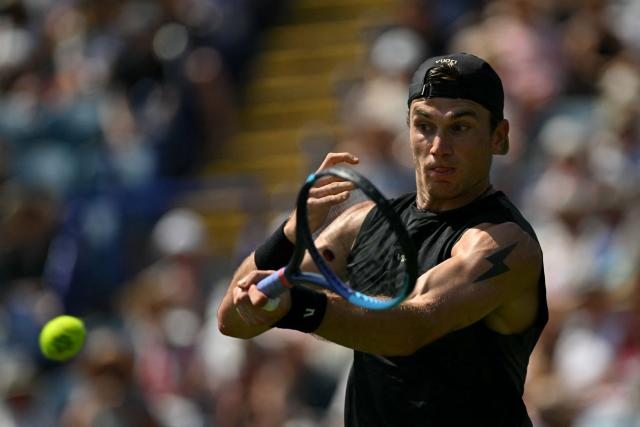 Britain's Jack Draper returns to US player Marcos Giron during their men's singles round of 32 tennis match on day one of the Lexus Eastbourne Open at Devonshire Park, Eastbourne, on the south coast of England on June 22, 2026. (Photo by Glyn KIRK / AFP)