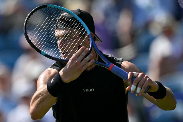 Britain's Jack Draper is pictured through his tennis racket during his match against US player Marcos Giron during their men's singles round of 32 tennis match on day one of the Lexus Eastbourne Open at Devonshire Park, Eastbourne, on the south coast of England on June 22, 2026. (Photo by Glyn KIRK / AFP)