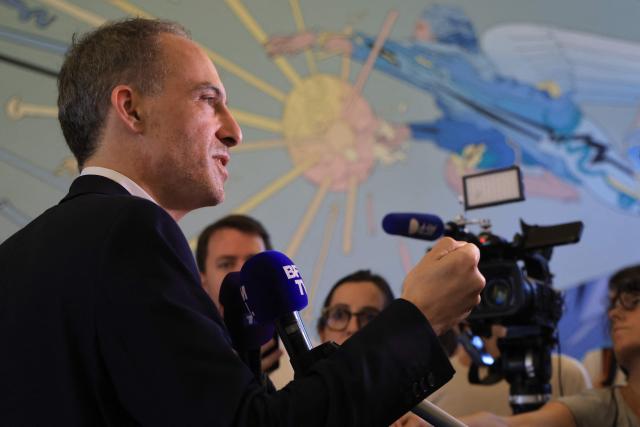 Place publique's centre-left party leader and MEP Raphael Glucksmann speaks to the press as he leaves after attending a debate on energy policies as part of "The Terra Nova Conversations" event organised by French center-left think tank Terra Nova at Le Beffroi de Montrouge, in Montrouge, south of Paris on June 22, 2026. (Photo by Ludovic MARIN / AFP)