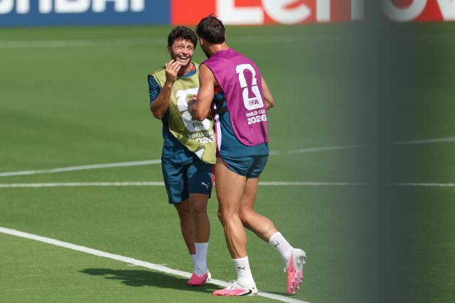 Portugal's midfielder #15 Joao Neves (L) reacts with Portugal's defender #03 Ruben Dias as they take part in an MD-1 training session at Gardens North County District Park in Palm Beach Gardens, on June 22, 2026, on the eve of the 2026 World cup Group K football match between Portugal and Uzbekistan. (Photo by PATRICIA DE MELO MOREIRA / AFP)