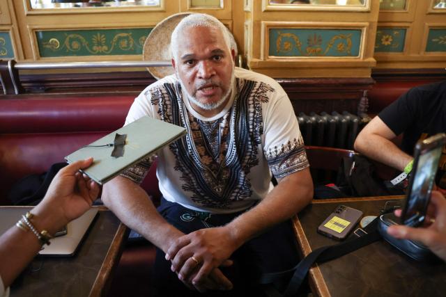 President of the Association Ultramarin Doubout, Andre Bazin delivers remarks to journalists in regards to a court decision on health issues allegedly linked to chlordecone persticide use, in a cafe near the Palais de Justice courthouse in Paris, on June 22, 2026. After 20 years of legal proceedings, the Paris Court of Appeal upheld a dismissal of the case on June 22, effectively ruling out any reopening of the criminal investigation into the health scandal involving a pesticide used in the French Caribbean despite warnings about its toxicity. (Photo by Charlotte SIEMON / AFP)