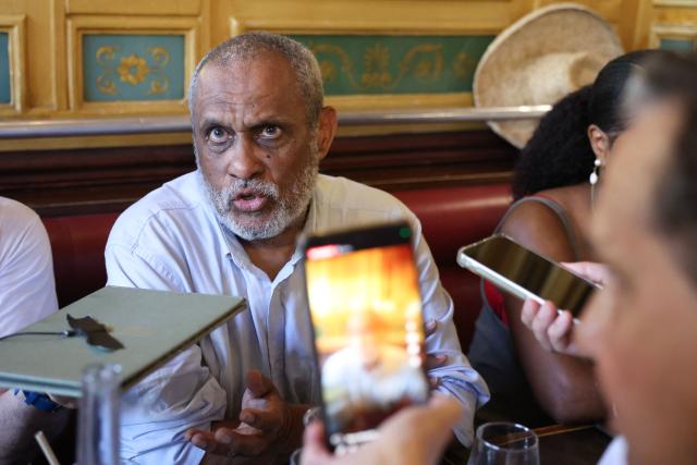 French doctor Jean-Claude Pitat delivers remarks to journalists in regards to a court decision on health issues allegedly linked to chlordecone persticide use, in a cafe near the Palais de Justice courthouse in Paris, on June 22, 2026. After 20 years of legal proceedings, the Paris Court of Appeal upheld a dismissal of the case on June 22, effectively ruling out any reopening of the criminal investigation into the health scandal involving a pesticide used in the French Caribbean despite warnings about its toxicity. (Photo by Charlotte SIEMON / AFP)