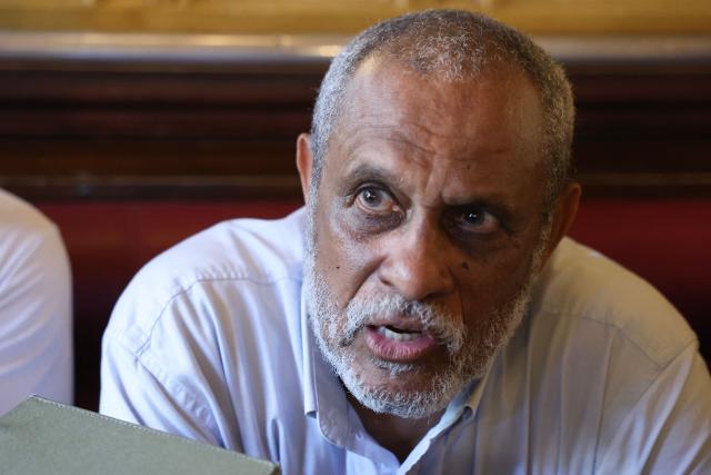 French doctor Jean-Claude Pitat delivers remarks to journalists in regards to a court decision on health issues allegedly linked to chlordecone persticide use, in a cafe near the Palais de Justice courthouse in Paris, on June 22, 2026. After 20 years of legal proceedings, the Paris Court of Appeal upheld a dismissal of the case on June 22, effectively ruling out any reopening of the criminal investigation into the health scandal involving a pesticide used in the French Caribbean despite warnings about its toxicity. (Photo by Charlotte SIEMON / AFP)