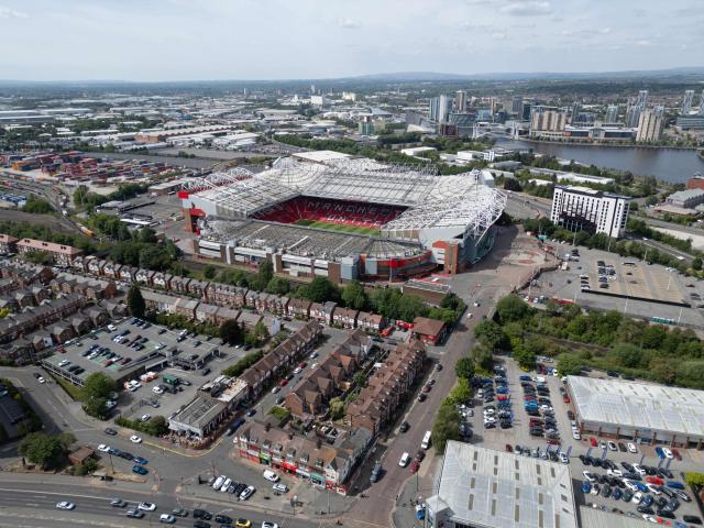 (FILES) An aerial view shows Old Trafford stadium, home ground of Manchester United Football Club, in Manchester, north west England, on May 23, 2025. Manchester United have secured the majority of the land needed to build their proposed new 100,000-capacity stadium. United announced on Monday, June 22, that they had acquired a 25-acre (10 hectare) site close to their current Old Trafford home. (Photo by Oli SCARFF / AFP)