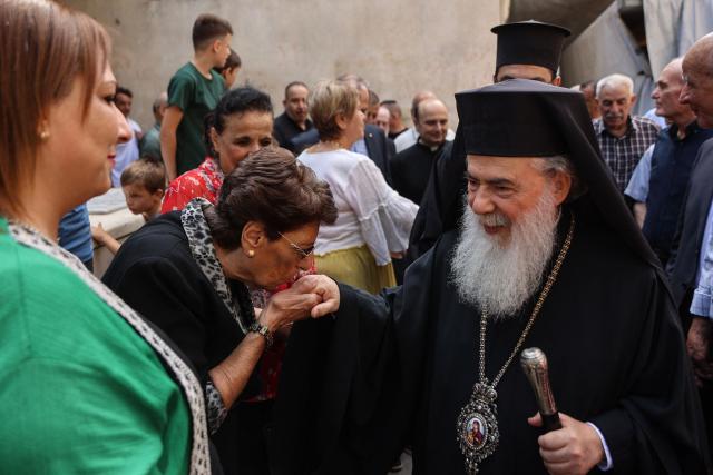 Greek Orthodox Patriarch of Jerusalem Theophilos III meets with the faithful during a visit to the Holy Family Church in Gaza City on June 22, 2026. Jerusalem's Latin Patriarch Cardinal Pierbattista Pizzaballa pledged on June 22 not to abandon Gaza's Christian community as he visited the territory with his Greek Orthodox counterpart. Pizzaballa and Patriarch Theophilos III arrived for a pastoral visit aimed at supporting both Gaza's small Christian population and its wider community after years of war and hardship. (Photo by Omar AL-QATTAA / AFP)