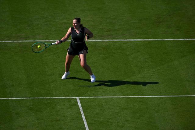 Latvia's Jelena Ostapenko returns to Britain's Francesca Jones during their women's singles round of 32 tennis match on day one of the Lexus Eastbourne Open at Devonshire Park, Eastbourne, on the south coast of England on June 22, 2026. (Photo by Glyn KIRK / AFP)