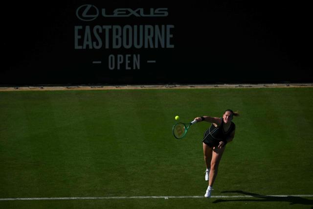 Latvia's Jelena Ostapenko serves to Britain's Francesca Jones during their women's singles round of 32 tennis match on day one of the Lexus Eastbourne Open at Devonshire Park, Eastbourne, on the south coast of England on June 22, 2026. (Photo by Glyn KIRK / AFP)