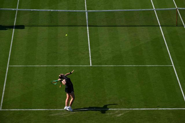 Latvia's Jelena Ostapenko serves to Britain's Francesca Jones during their women's singles round of 32 tennis match on day one of the Lexus Eastbourne Open at Devonshire Park, Eastbourne, on the south coast of England on June 22, 2026. (Photo by Glyn KIRK / AFP)