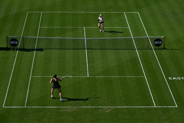 Latvia's Jelena Ostapenko returns to Britain's Francesca Jones during their women's singles round of 32 tennis match on day one of the Lexus Eastbourne Open at Devonshire Park, Eastbourne, on the south coast of England on June 22, 2026. (Photo by Glyn KIRK / AFP)