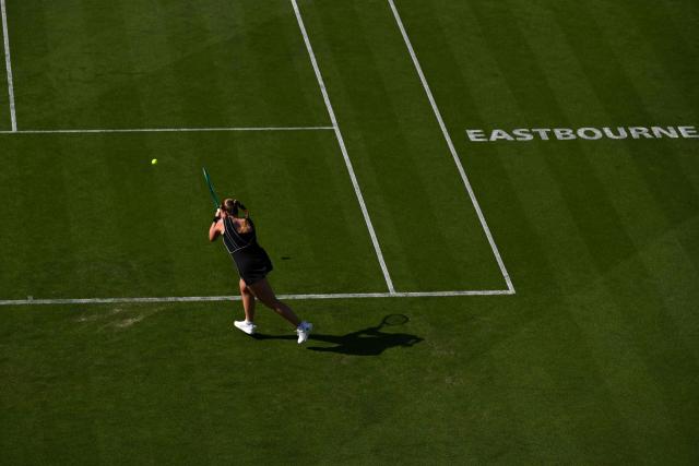 Latvia's Jelena Ostapenko returns to Britain's Francesca Jones during their women's singles round of 32 tennis match on day one of the Lexus Eastbourne Open at Devonshire Park, Eastbourne, on the south coast of England on June 22, 2026. (Photo by Glyn KIRK / AFP)