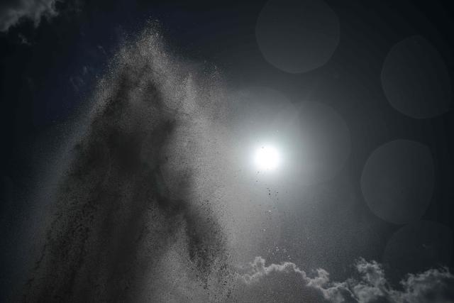 This photography shows water at the Trocadero Fountain during a heatwave in Paris on June 22, 2026. The latest bout of exceptionally high temperatures to hit Europe has seen outdoor events cancelled, transport disrupted, schools shut and office workers told to work from home, as the authorities issued health alerts to protect the elderly and vulnerable. In France, the epicentre of the weather anomaly, 54 of the country's 96 mainland departments were on the highest heat alert, with temperatures forecast to climb up to 43C in the southwestern city of Bordeaux and 39C in the capital Paris, said national weather service Meteo-France. (Photo by JULIEN DE ROSA / AFP)