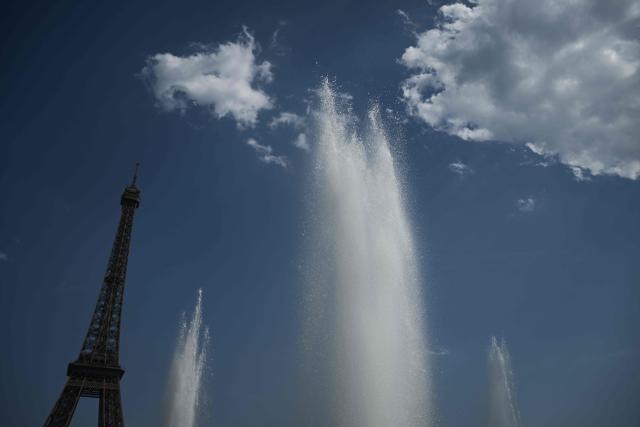 This photography shows water at the Trocadero Fountain near the Eiffel Tower during a heatwave in Paris on June 22, 2026. The latest bout of exceptionally high temperatures to hit Europe has seen outdoor events cancelled, transport disrupted, schools shut and office workers told to work from home, as the authorities issued health alerts to protect the elderly and vulnerable. In France, the epicentre of the weather anomaly, 54 of the country's 96 mainland departments were on the highest heat alert, with temperatures forecast to climb up to 43C in the southwestern city of Bordeaux and 39C in the capital Paris, said national weather service Meteo-France. (Photo by JULIEN DE ROSA / AFP)