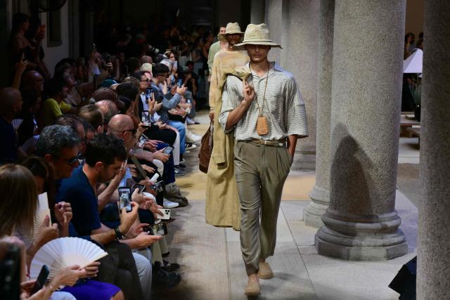 A model presents a creation during the Giorgio Armani Men’s Spring / Summer 2027 & Women’s Cruise Collection show, in Milan on June 22, 2026. (Photo by Stefano RELLANDINI / AFP)