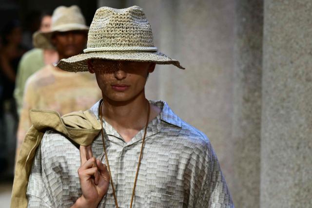 A model presents a creation during the Giorgio Armani Men’s Spring / Summer 2027 & Women’s Cruise Collection show, in Milan on June 22, 2026. (Photo by Stefano RELLANDINI / AFP)