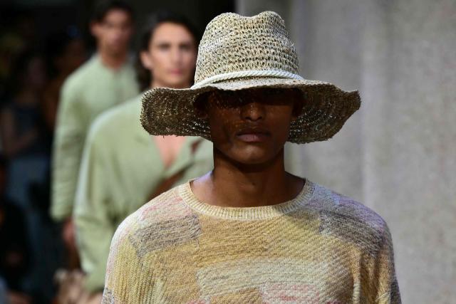 A model presents a creation during the Giorgio Armani Men’s Spring / Summer 2027 & Women’s Cruise Collection show, in Milan on June 22, 2026. (Photo by Stefano RELLANDINI / AFP)