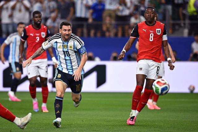 Argentina's forward #10 Lionel Messi (L) fights for the ball with Austria's defender #08 David Alaba (R)  during the 2026 World Cup Group J football match between Argentina and Austria at the Dallas Stadium in Arlington on June 22, 2026.  (Photo by Paul ELLIS / AFP)