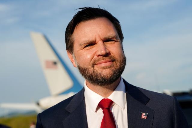 US Vice President JD Vance speaks to members of the media before boarding Air Force Two as he leaves Switzerland after meeting with representatives from Iran to negotiate details of their peace agreement at Emmen Air Base, near Lucerne, on June 22, 2026. (Photo by Nathan Howard / POOL / AFP)