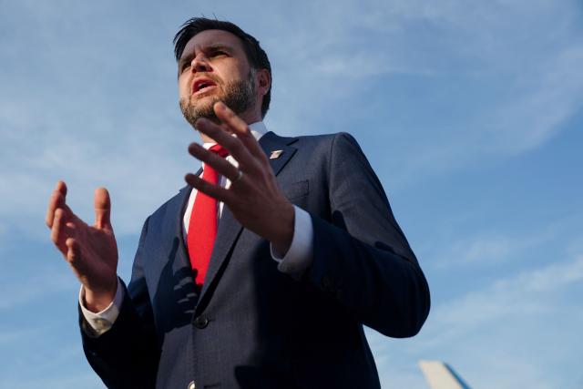 US Vice President JD Vance speaks to members of the media before boarding Air Force Two as he leaves Switzerland after meeting with representatives from Iran to negotiate details of their peace agreement at Emmen Air Base, near Lucerne, on June 22, 2026. (Photo by Nathan Howard / POOL / AFP)