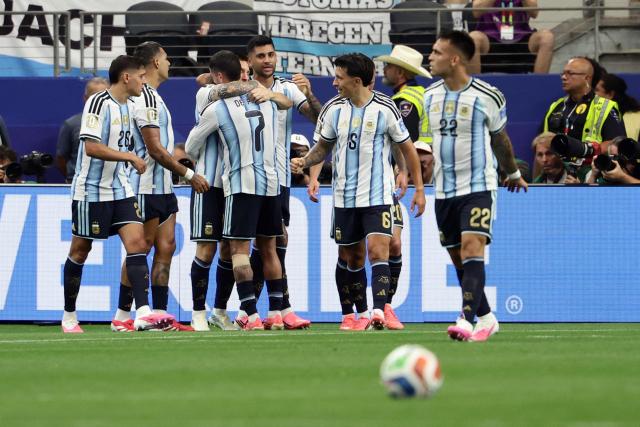 Argentina's forward #10 Lionel Messi (3rdL) is congratulated by teammates after scoring a goal during the 2026 World Cup Group J football match between Argentina and Austria at the Dallas Stadium in Arlington on June 22, 2026.  (Photo by Aric Becker / AFP)