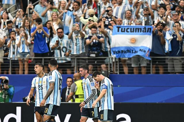 Argentina's forward #10 Lionel Messi (R) reacts  after scoring the opening goal during the 2026 World Cup Group J football match between Argentina and Austria at the Dallas Stadium in Arlington on June 22, 2026.  (Photo by Paul ELLIS / AFP)