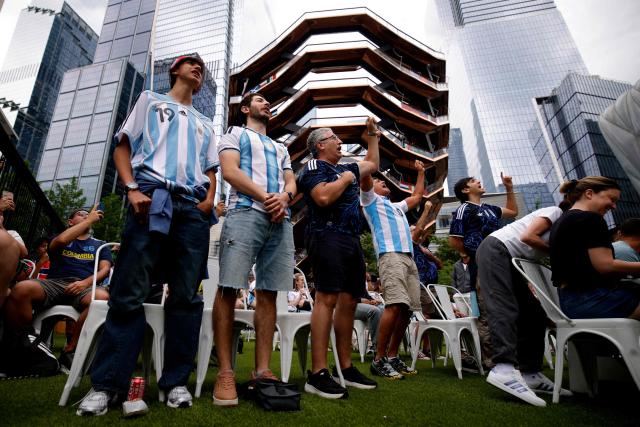 Fans react as they attend a watch party for the 2026 World Cup football tournament match between Argentina and Austria, at Hudson Yards Backyard in New York City on June 22, 2026. (Photo by Leonardo MUNOZ / AFP)