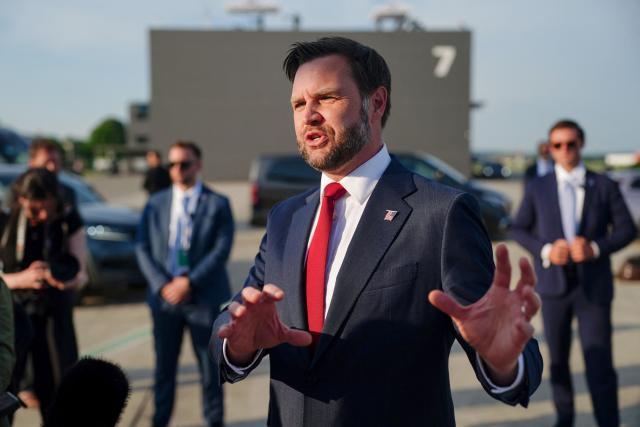 US Vice President JD Vance speaks to members of the media before boarding Air Force Two as he leaves Switzerland after meeting with representatives from Iran to negotiate details of their peace agreement at Emmen Air Base, near Lucerne, on June 22, 2026. (Photo by Nathan Howard / POOL / AFP)