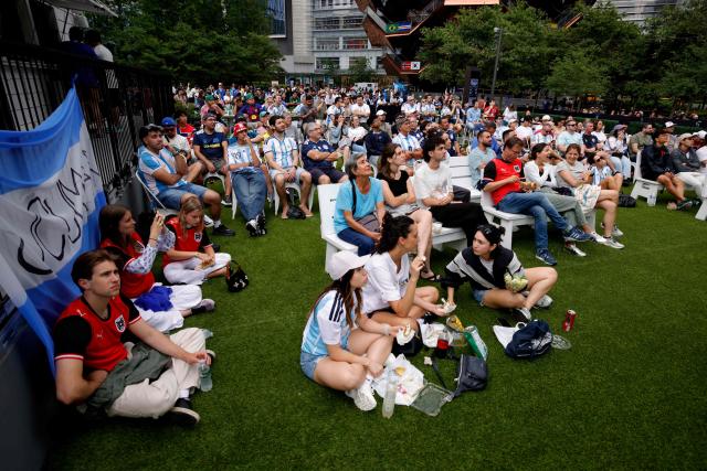 People attend a watch party for the 2026 World Cup football tournament match between Argentina and Austria, at Hudson Yards Backyard in New York City on June 22, 2026. (Photo by Leonardo MUNOZ / AFP)