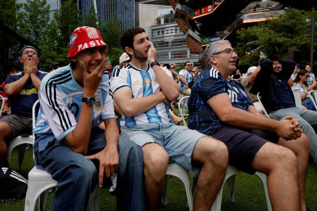 People attend a watch party for the 2026 World Cup football tournament match between Argentina and Austria, at Hudson Yards Backyard in New York City on June 22, 2026. (Photo by Leonardo MUNOZ / AFP)
