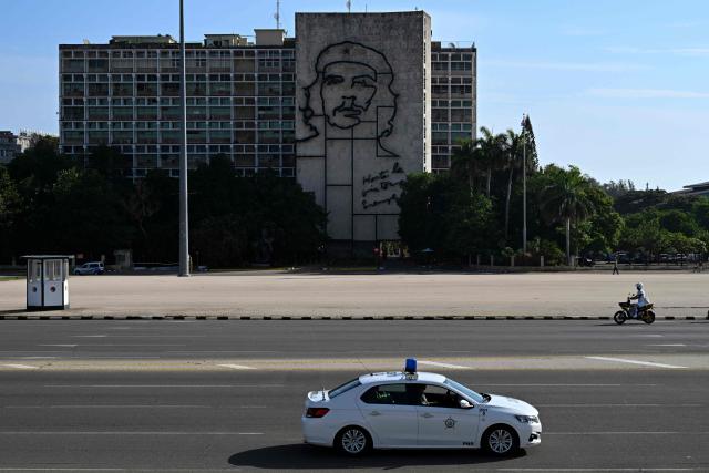 View of the Ministry of the Interior building bearing an image of Ernesto "Che" Guevara, an Argentine-born revolutionary who played a key role in Cuba's 1959 revolution, at Revolution Square in Havana on June 22, 2026. (Photo by YAMIL LAGE / AFP)