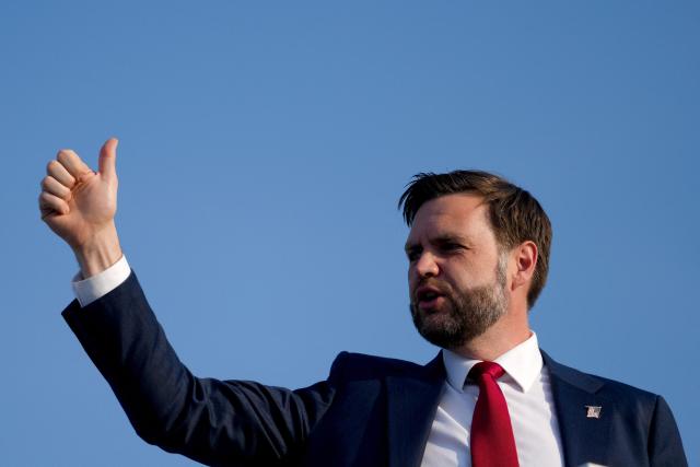 US Vice President JD Vance thumbs up as he boards Air Force Two as he leaves Switzerland after meeting with representatives from Iran to negotiate details of their peace agreement at Emmen Air Base, near Lucerne, on June 22, 2026. (Photo by Nathan Howard / POOL / AFP)