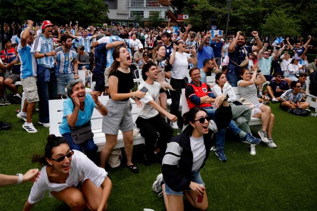 Argentina fans celebrate a goal as they attend a watch party for the 2026 World Cup football tournament match between Argentina and Austria, at Hudson Yards Backyard in New York City on June 22, 2026. (Photo by Leonardo MUNOZ / AFP)