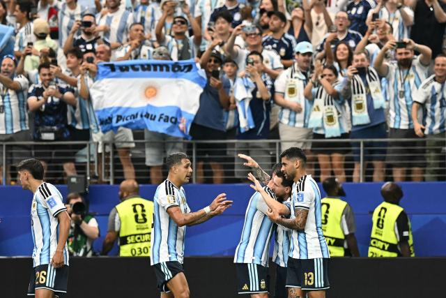 Argentina's forward #10 Lionel Messi (2nd R) celebrates with teammates  after scoring the opening goal during the 2026 World Cup Group J football match between Argentina and Austria at the Dallas Stadium in Arlington on June 22, 2026.  (Photo by Paul ELLIS / AFP)