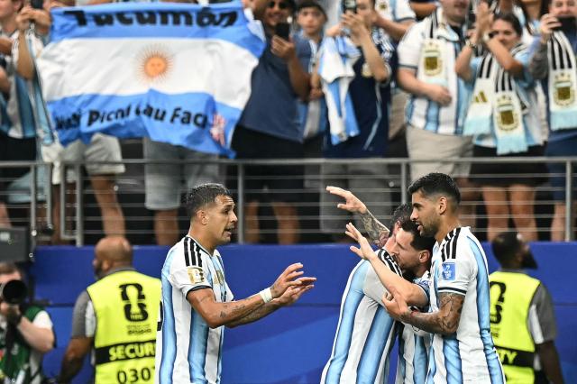 Argentina's forward #10 Lionel Messi (2nd R) celebrates with teammates  after scoring the opening goal during the 2026 World Cup Group J football match between Argentina and Austria at the Dallas Stadium in Arlington on June 22, 2026.  (Photo by Paul ELLIS / AFP)