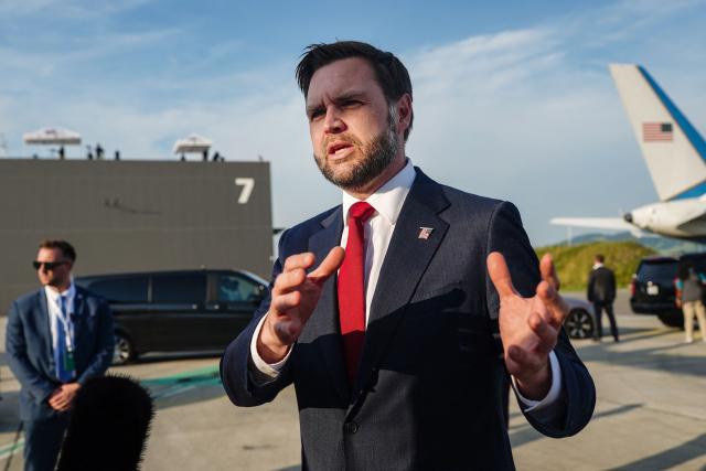 US Vice President JD Vance speaks to members of the media before boarding Air Force Two as he leaves Switzerland after meeting with representatives from Iran to negotiate details of their peace agreement at Emmen Air Base, near Lucerne, on June 22, 2026. (Photo by Nathan Howard / POOL / AFP)