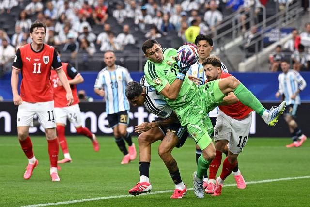 Argentina's goalkeeper #23 Emiliano Martinez catches the ball  during the 2026 World Cup Group J football match between Argentina and Austria at the Dallas Stadium in Arlington on June 22, 2026.  (Photo by Paul ELLIS / AFP)